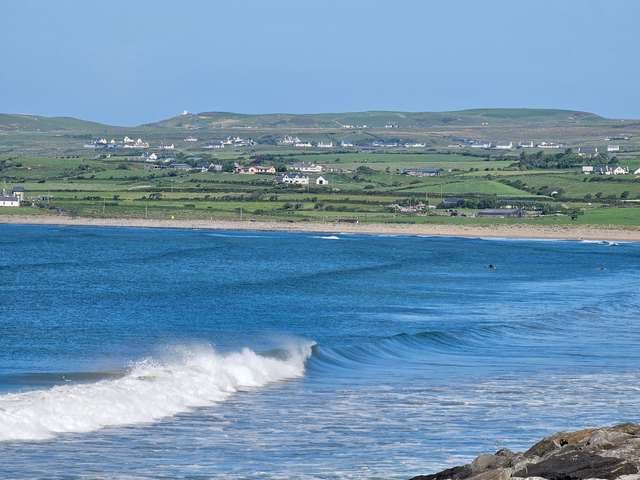 solid swell along the beach but the tide is a bit too high for the surfers